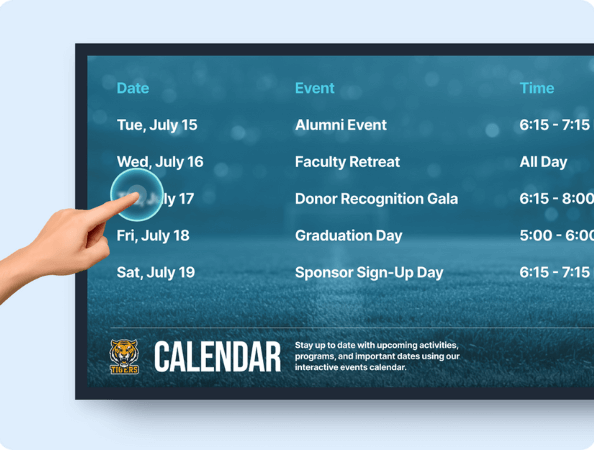 A hand touching an interactive display showing a calendar