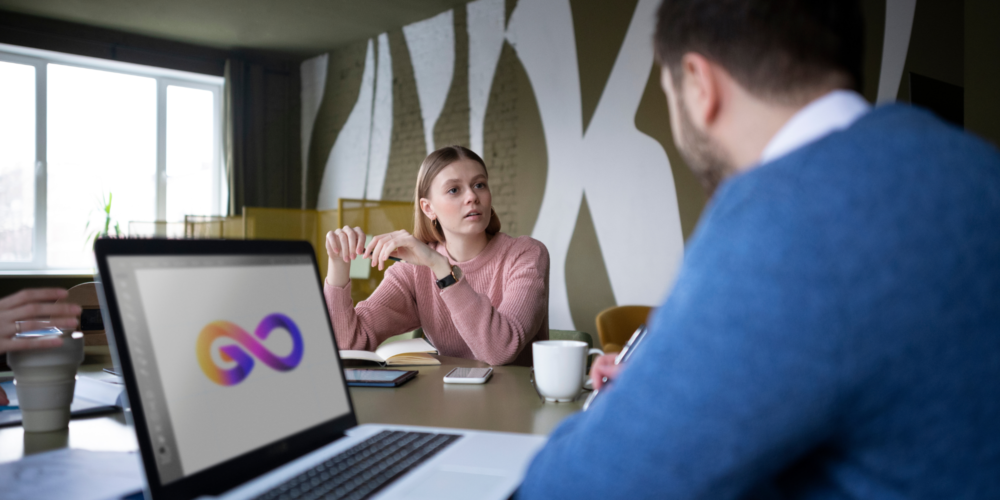 Two coworkers discussing in the office.