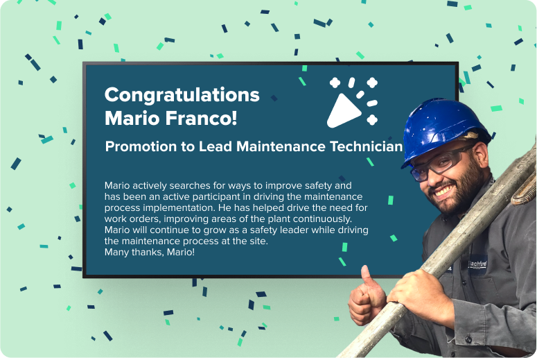 Male with blue hard hat in front of a digital display