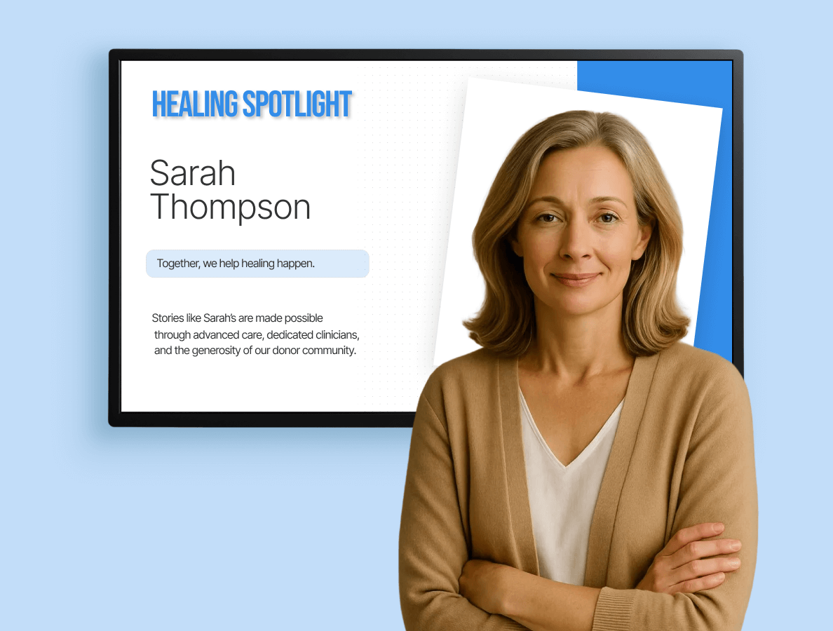 A woman standing in front of a digital display that says "Healing Spotlight"
