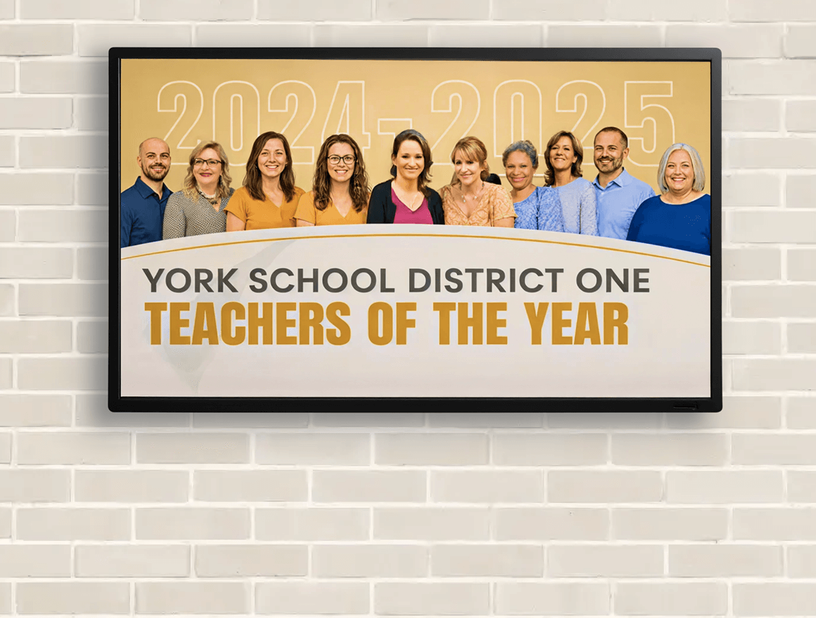 York School District Teachers of the Year display on a white brick wall