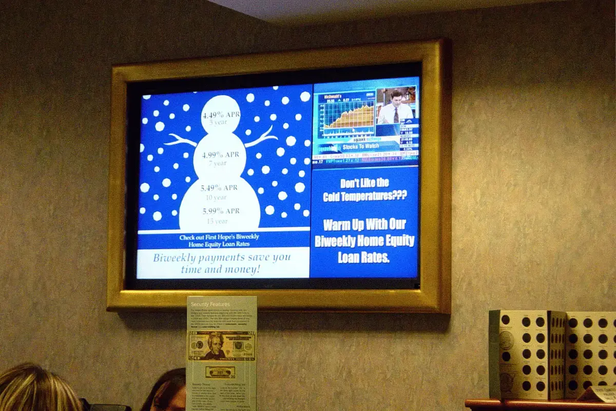 A digital signage display promoting financial products