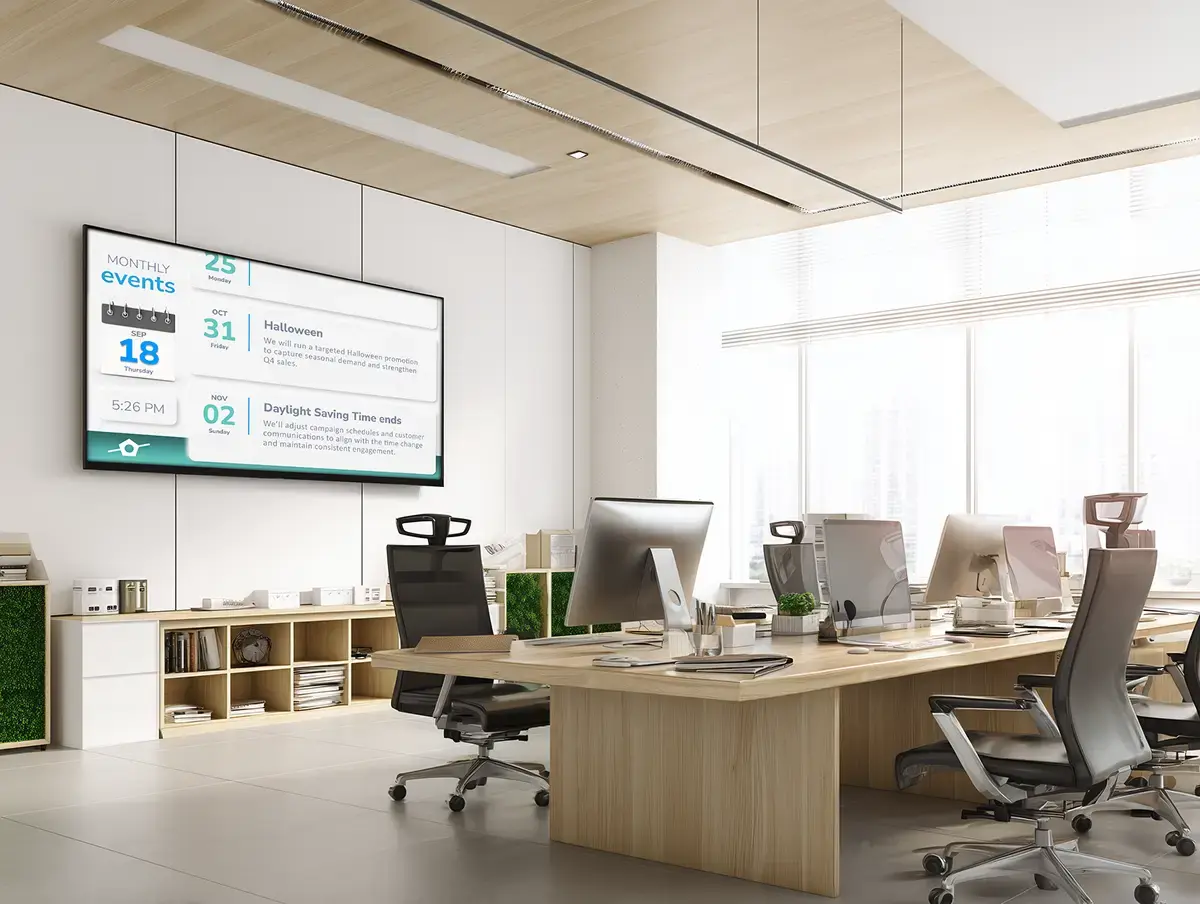 Modern office setting with a digital calendar display hanged on a large backwall