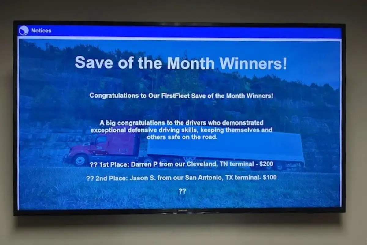 A safety compliance digital signage mounted on a wall